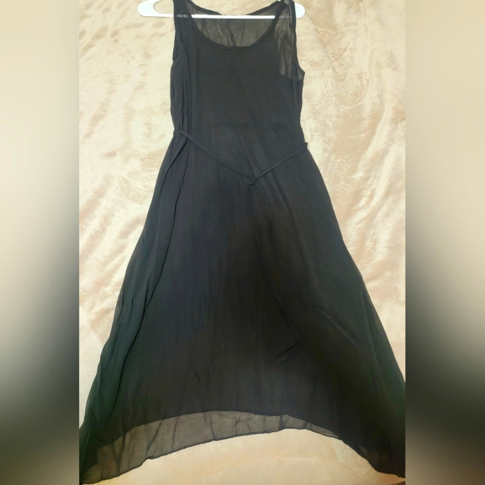 Black sheer dress or bathing suit cover.